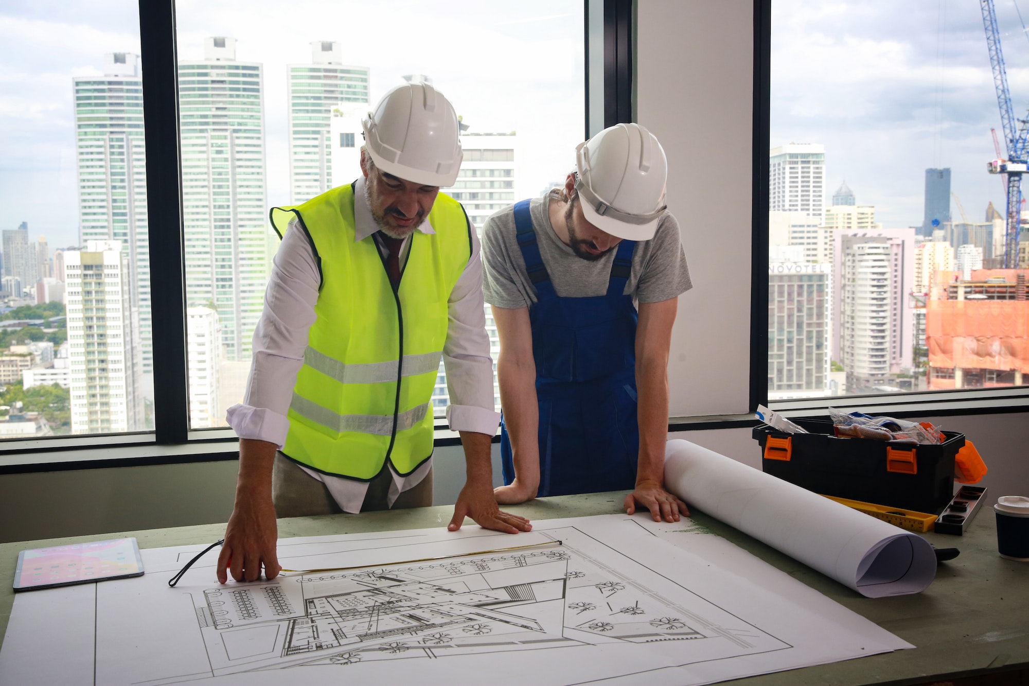 Portrait of young male surveyor on construction site